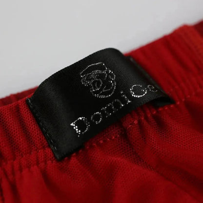 Close-up of DomiGe logo on Comfort Flex Waistband — red modal mesh boxer briefs with adaptive fit	