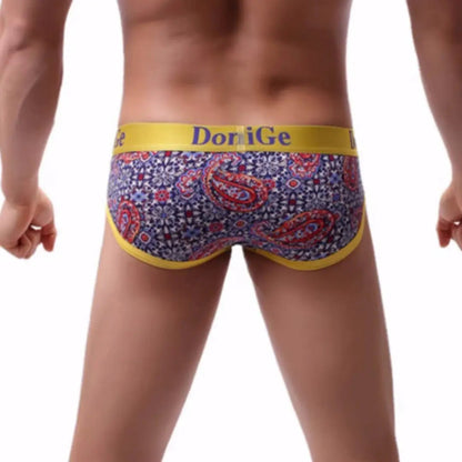 Rear view of DomiGe red paisley print briefs — seamless one-piece back with no center seam	