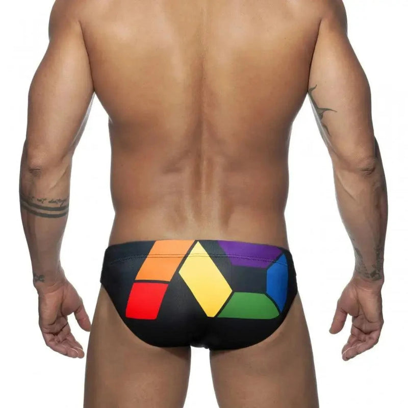 DomiGe men's solid swim briefs in black — model rear view	