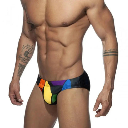 DomiGe men's solid swim briefs in black — model side view	