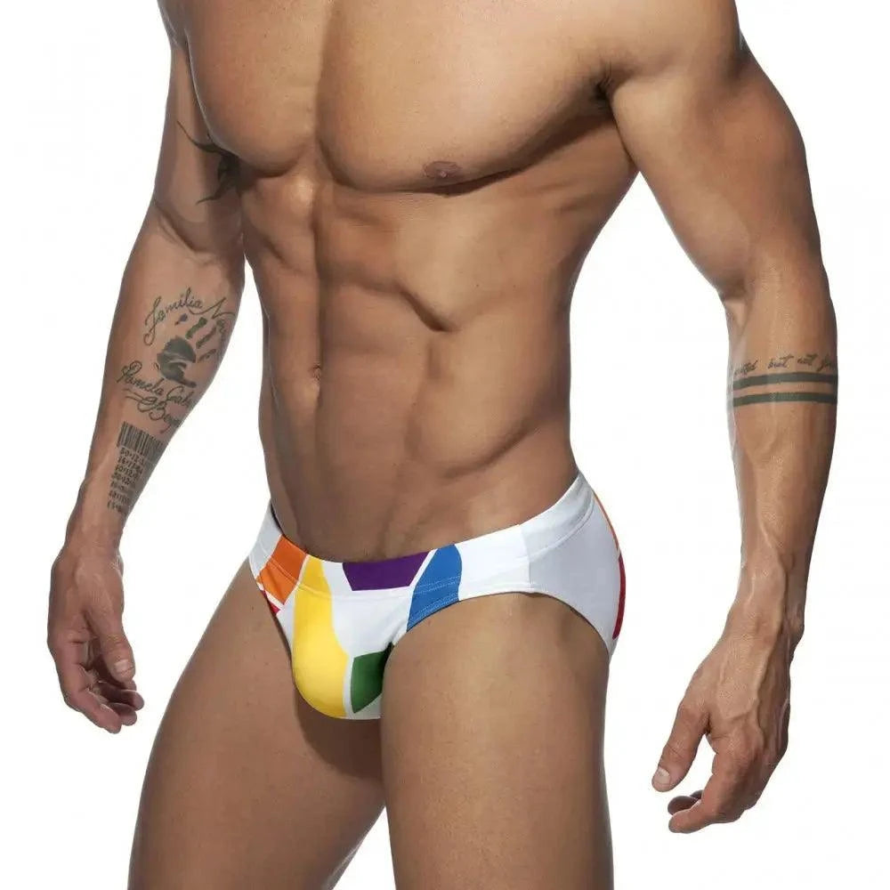 DomiGe men's solid swim briefs in white — model side view	