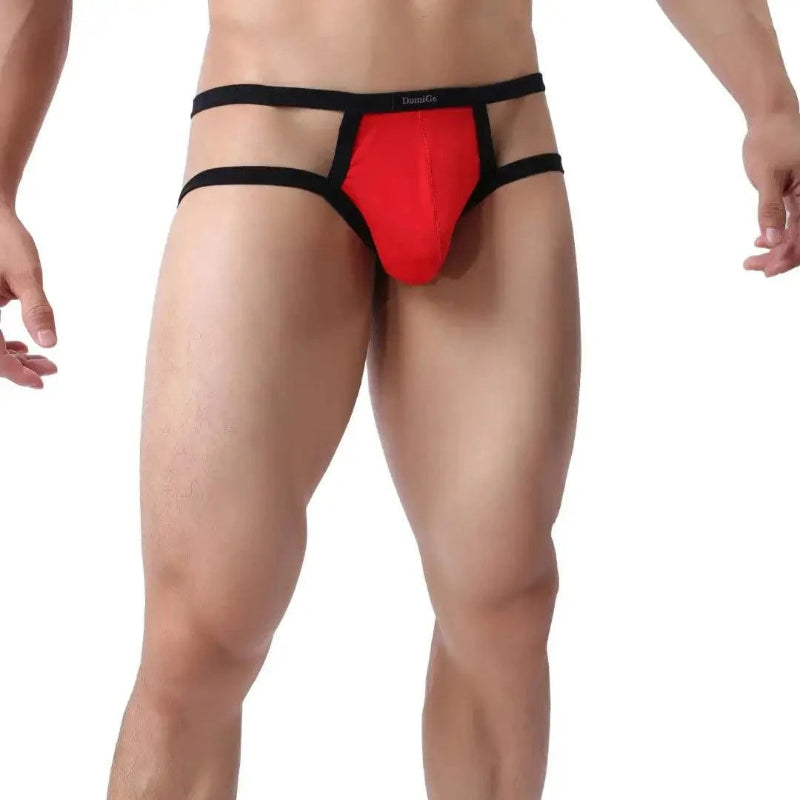 DomiGe X-Design jockstrap in red — model side view showing low-rise fit and waistband straps	