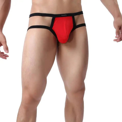 DomiGe X-Design jockstrap in red — model side view showing low-rise fit and waistband straps	