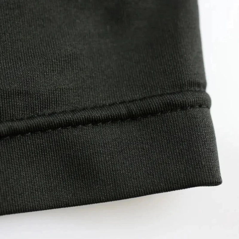 88.6% polyester 11.4% spandex stretch fabric texture close-up black — moisture-wicking tank DomiGe	