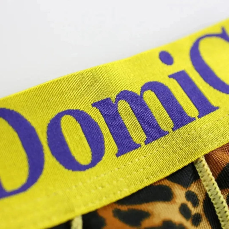 DomiGe bold gold logo elastic waistband detail — low-rise trunks gold	