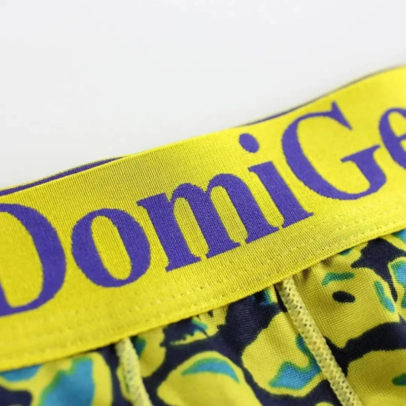 DomiGe bold gold logo elastic waistband detail — low-rise trunks green	